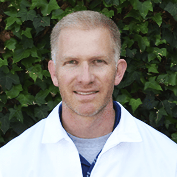 Portrait of Dr. Matt with leaves in background outside Scoliosis Care Centers Clinic