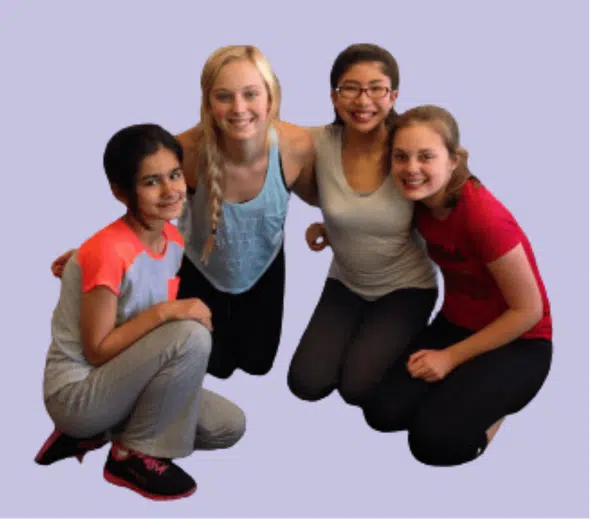 Group of girl patients hugging while smiling for the picture.